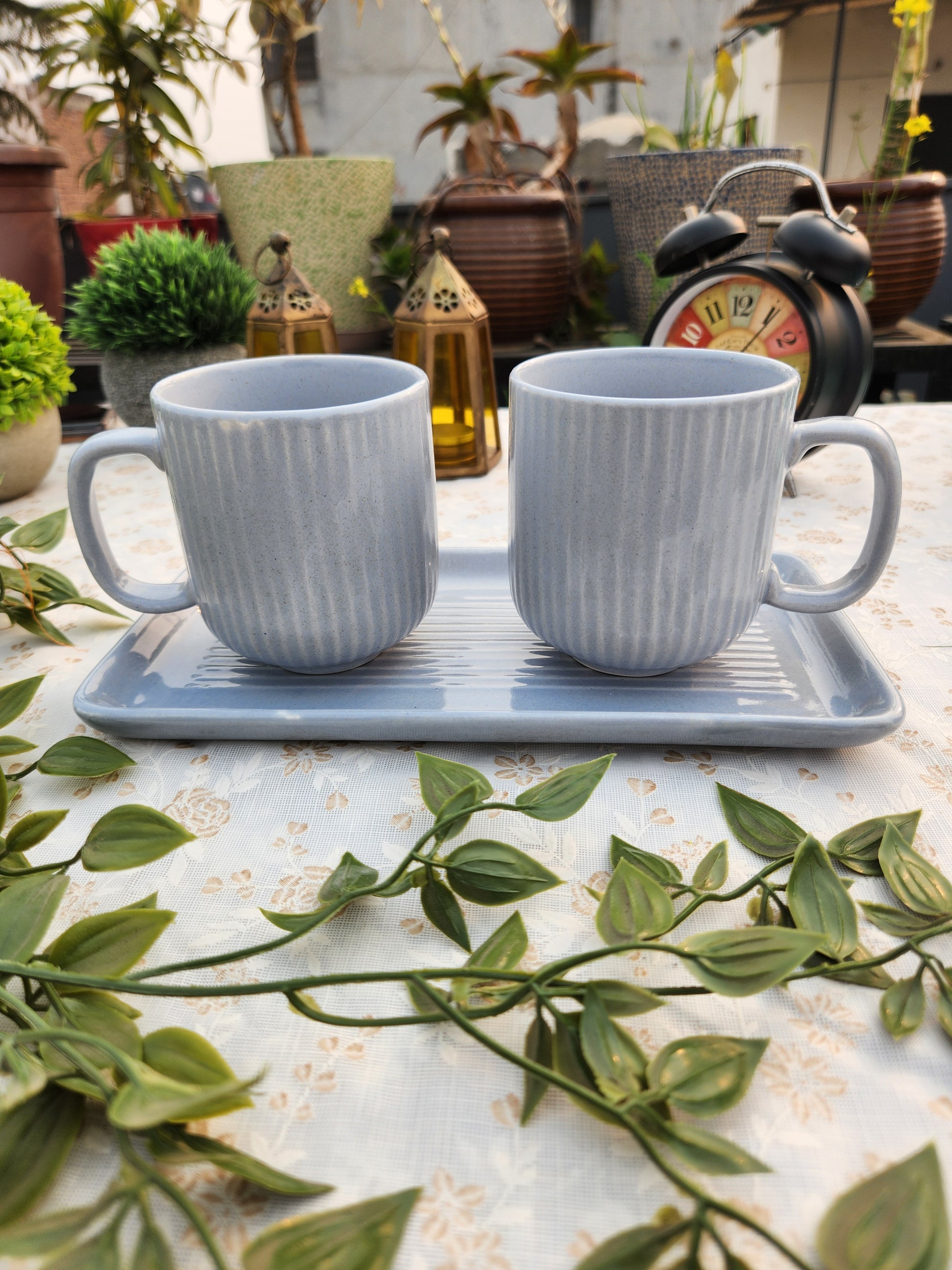 set of 3 ceramic coffee mugs with a tray